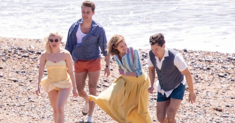 Harry Styles, Emma Corrin and David Dawson Skip Down the Beach on ‘My Policeman’ Set: Pics – Us Weekly