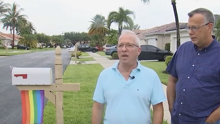 A gay couple was ordered to take down their Pride flag & now their neighbors are flying them too – LGBTQ Nation